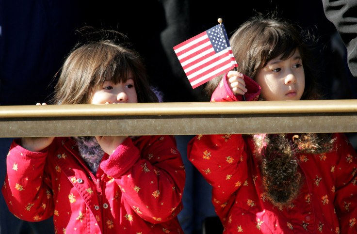 Two girls watch changing of the guard at Arlington Cemetary, Virginia