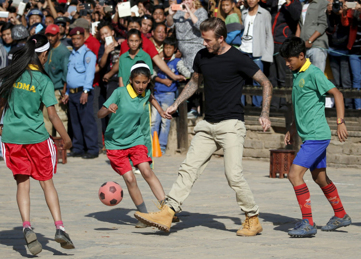 David Beckham kicks a ball during the charity match