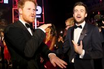Britain's Prince Harry greets comedian Jack Whitehall 