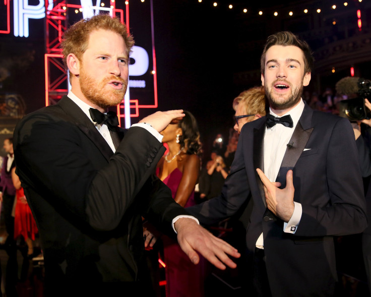 Britain's Prince Harry greets comedian Jack Whitehall 