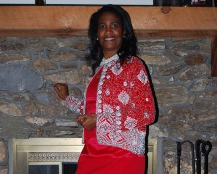 CLEASTER COTTON © 2013 - Cheryl Johnson poses in front of her fireplace @ her and Gene's Party