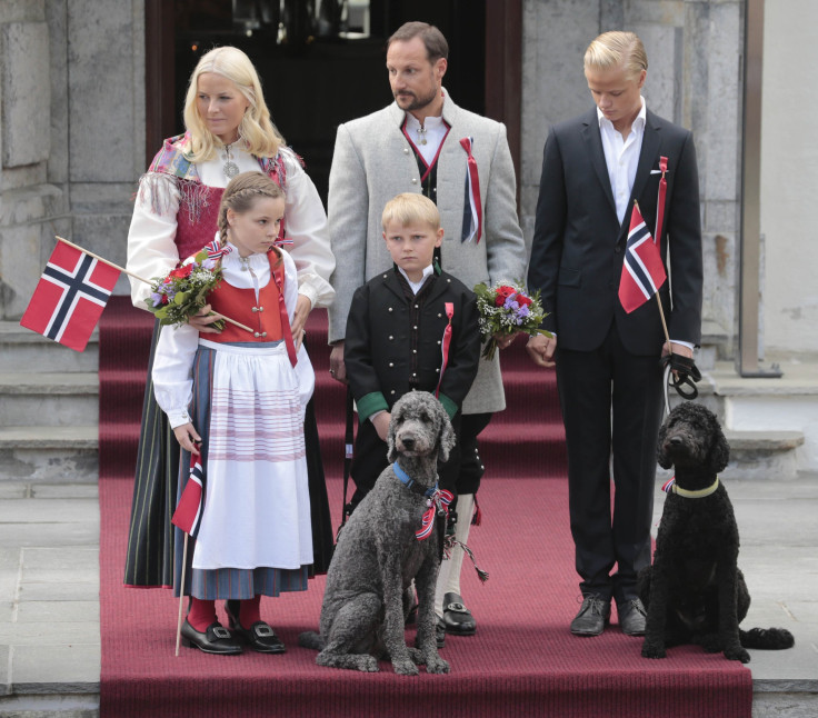 Norway's Crown Princess Mette-Marit, Prince Sverre Magnus, Crown Prince Haakon, Princess Ingrid Alexandra and Marius Borg Hoiby look at children taking part in a parade in celebration of the Norwegian Constitution Day