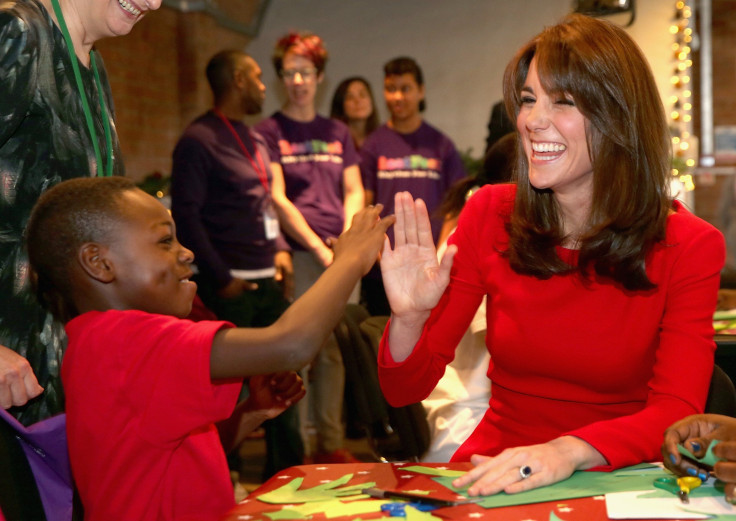 Britain's Catherine, Duchess of Cambridge takes part in group activities as she attends the Anna Freud Centre Family School Christmas Party 