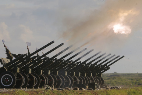 Russian guns are fired during a military salute outside Moscow.