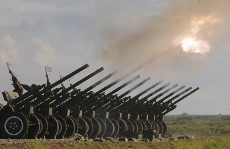 Russian guns are fired during a military salute outside Moscow.