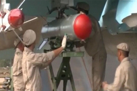 Russian engineers working on an aircraft in Syria