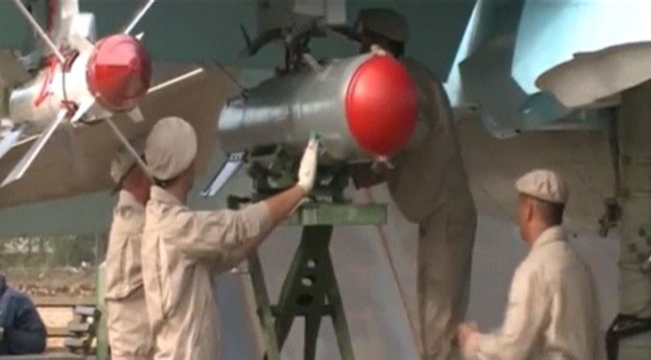 Russian engineers working on an aircraft in Syria