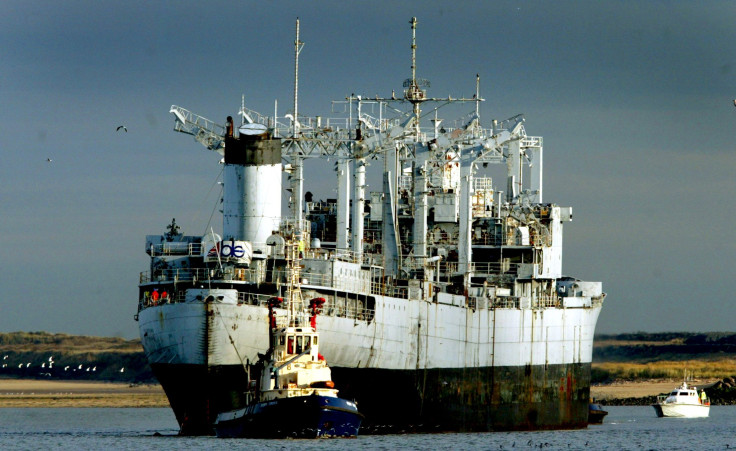 An old U.S. Navy ship is towed to the U.K.