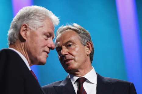 Bill Clinton and Tony Blair talk during an awards ceremony