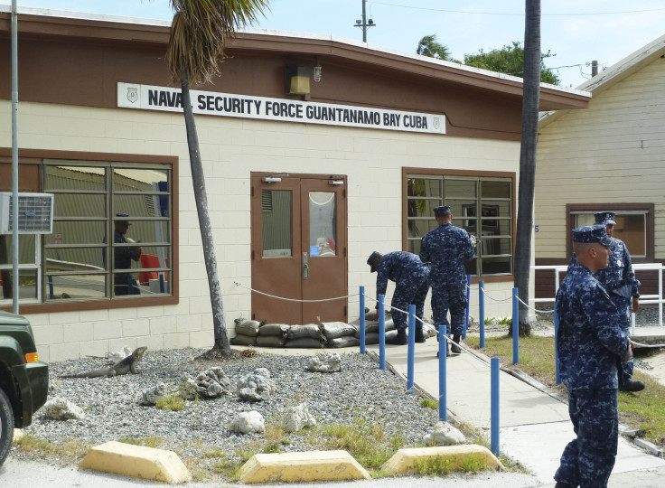 U.S. Navy personnel complete tasks at the Guantanamo Bay prison in Cuba. 
