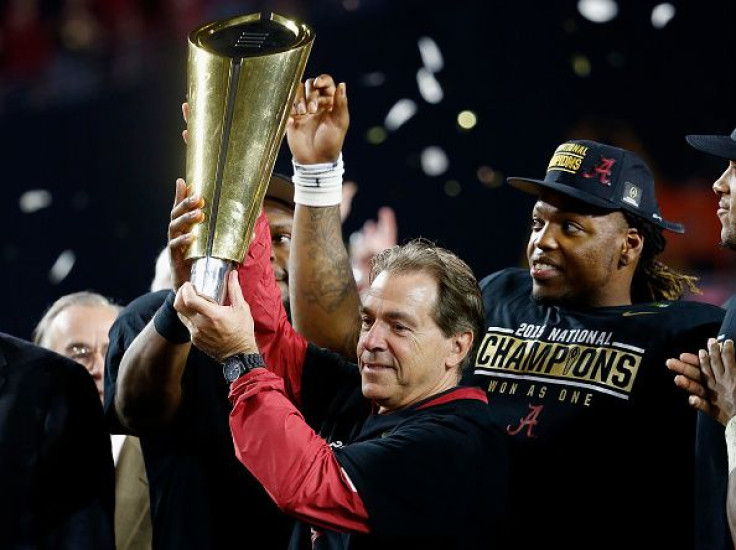 Nick Saban with CFP trophy