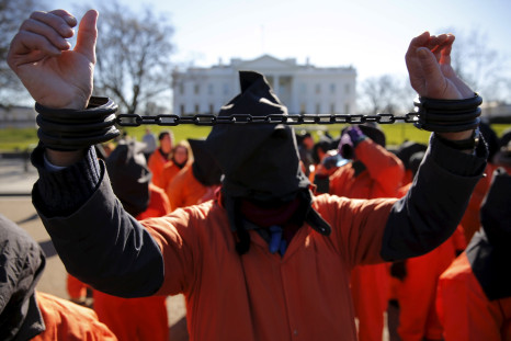 A protester dressed as a Gunatanamo Bay detainee in front of the White House.