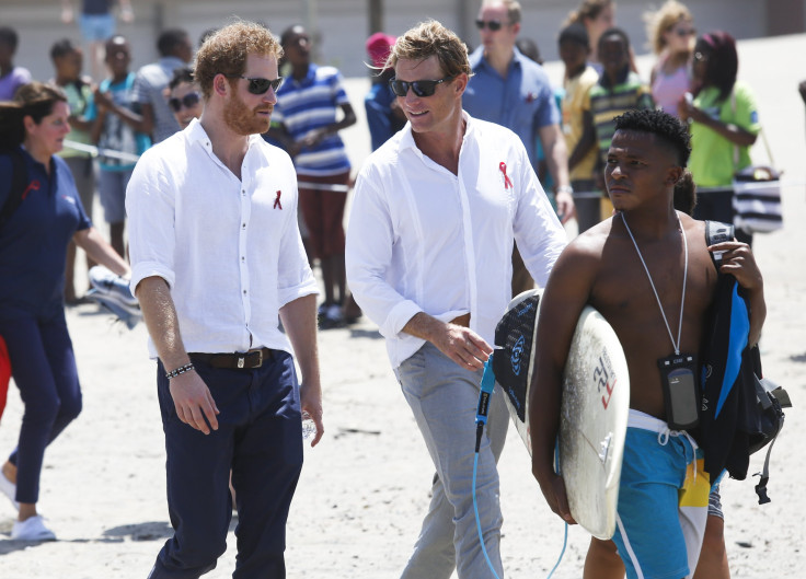 Britain's Prince Harry speaks with Tom Hewitt