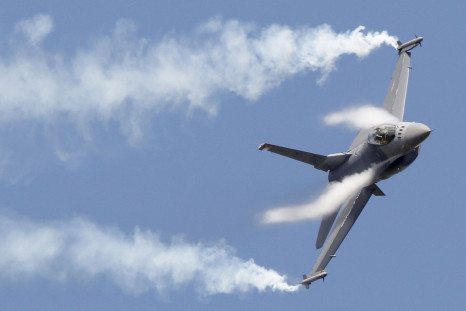 An F-16 maneuvers during an air show in Paris, France. 