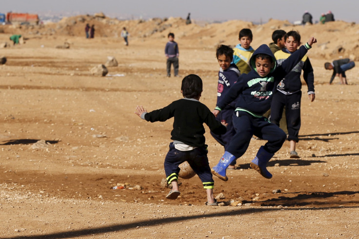 Syrian children inside a Jordanian refugee camp.