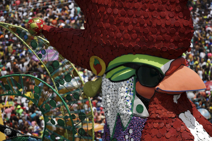 The head of a rooster moves through the crowds during a parade in Recife. 