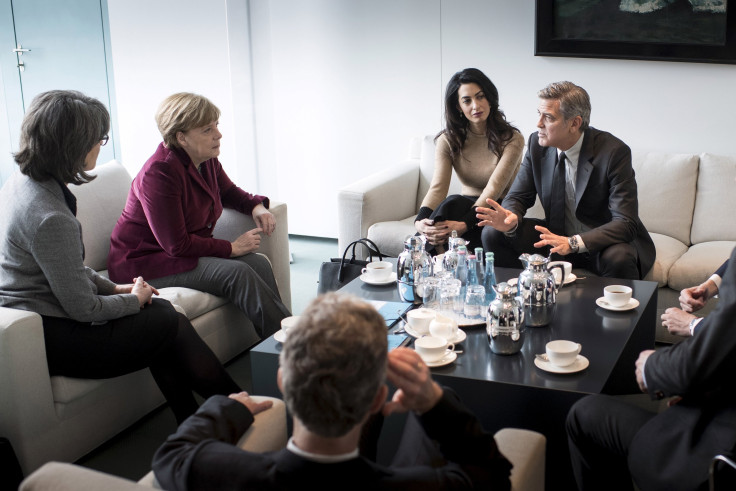 German Chancellor Angela Merkel along with actor George Clooney and his wife Amal