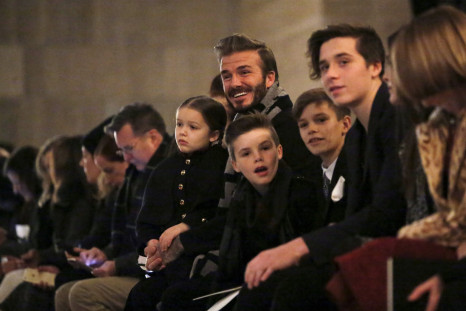 David Beckham sits in the front row at the Victoria Beckham Fall/Winter 2016 collection presentation with his children