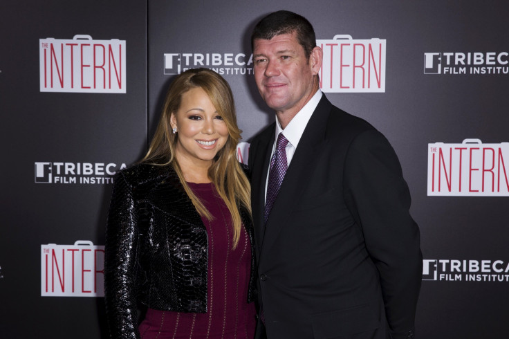 Singer Mariah Carey and James Packer share a kiss before her performance