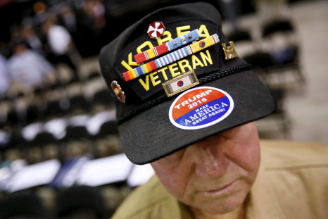 A veteran wearing a cap before a political rally.
