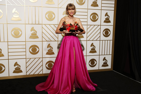 Singer Taylor Swift poses with her Grammy Awards