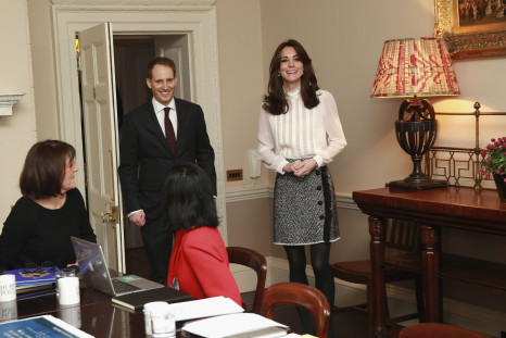 Britain's Catherine, Duchess of Cambridge wears Reiss top and D&G skirt