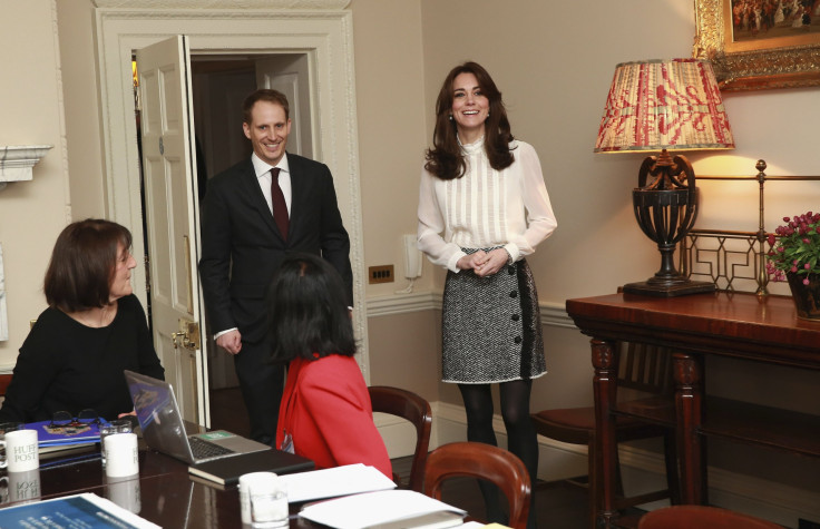 Britain's Catherine, Duchess of Cambridge wears Reiss top and D&G skirt