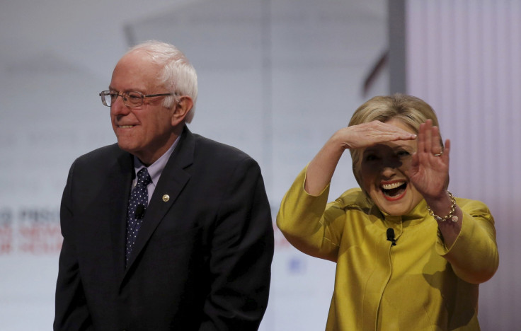 Bernie Sanders and Hillary Clinton on stage at the start of a debate.