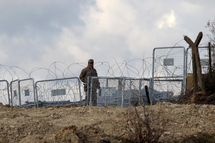 A Turkish soldiers stands guard on the Syrian border. 