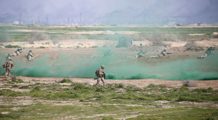 U.S. coalition troops watch Iraqi soldiers during training exercises in Iraq. 