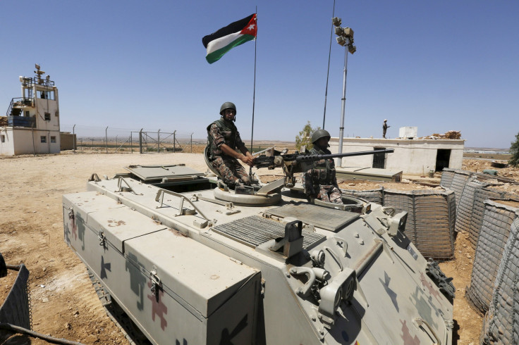 Stationary tanks at the border crossing between Jordan and Syria.