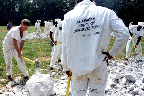 Alabama inmates crushing limestone as part of a chain gang. 
