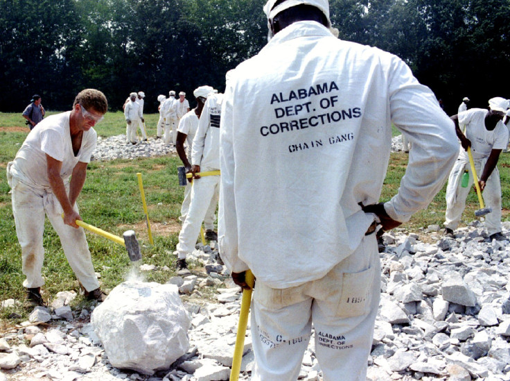 Alabama inmates crushing limestone as part of a chain gang. 
