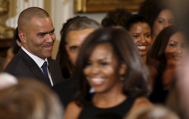 Cast member Christopher Jackson (L) from the hit musical 'Hamilton' watches U.S. President Barack Obama and Michelle Obama arrive 