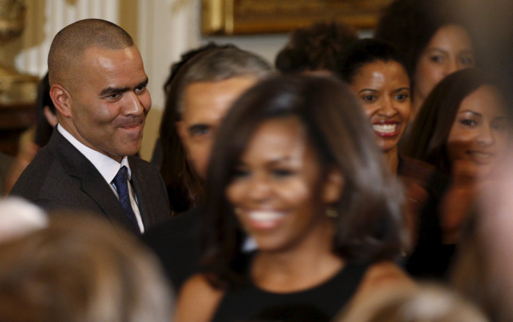 Cast member Christopher Jackson (L) from the hit musical 'Hamilton' watches U.S. President Barack Obama and Michelle Obama arrive