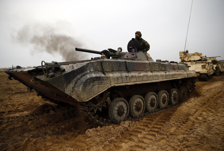 A Polish soldier operates a Soviet-built BWP-1 fighting vehicle. 