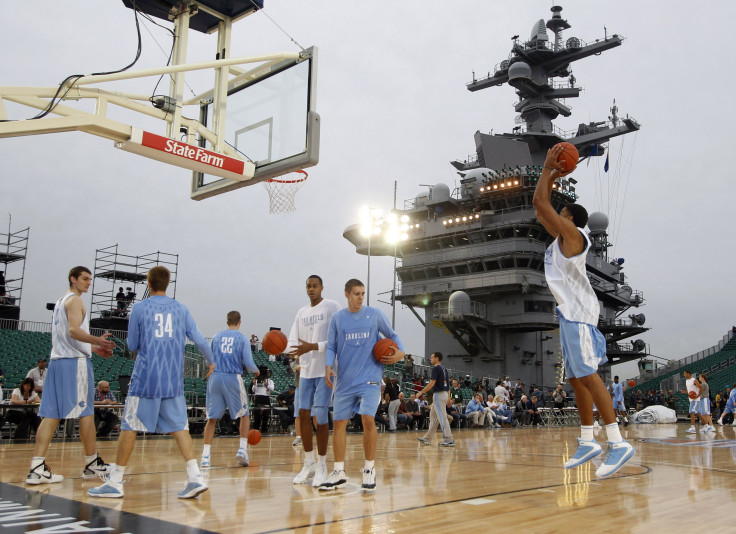North Carolina players warm up ahead of a game onboard the USS Carl Vinson.
