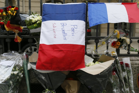 A French flag in Paris with a message for victims in Brussels. 