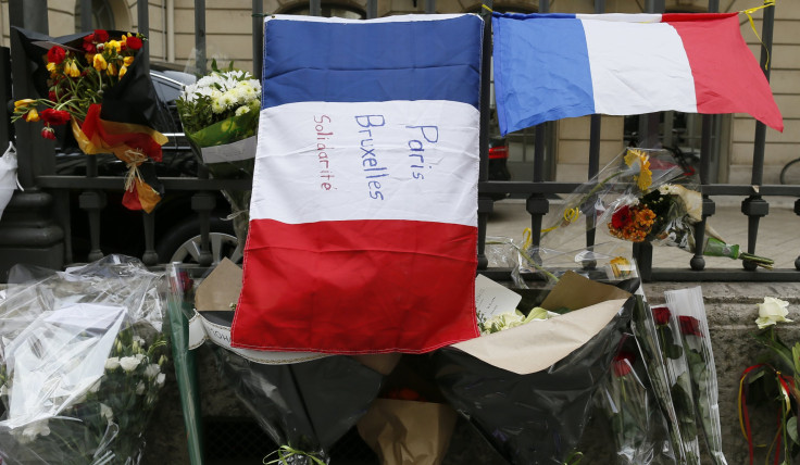 A French flag in Paris with a message for victims in Brussels. 