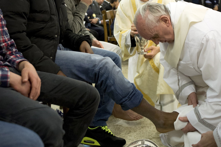 Pope Francis washes the feet of a prisoner at a prison in Rome. 
