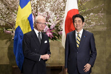 King Carl XVI Gustaf of Sweden (L) and Japanese Prime Minister Shinzo Abe