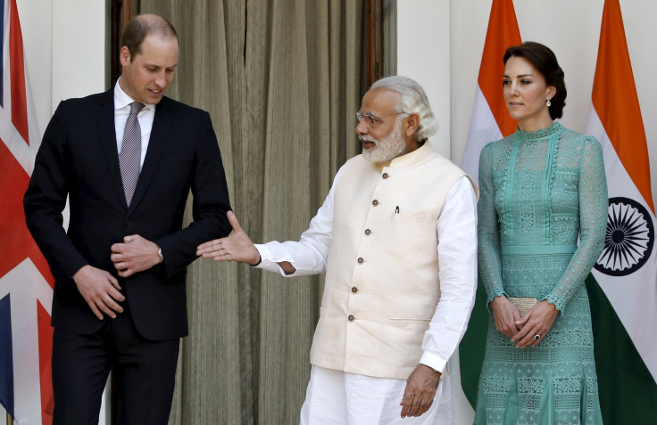 Britain's Prince William shakes hands with India's Prime Minister Narendra Modi (C) as Catherine, Duchess of Cambridge looks on