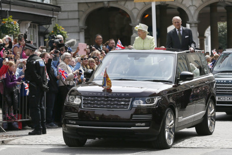 Britain's Queen Elizabeth is driven past well wishers on her 90th birthday with Prince Philip 