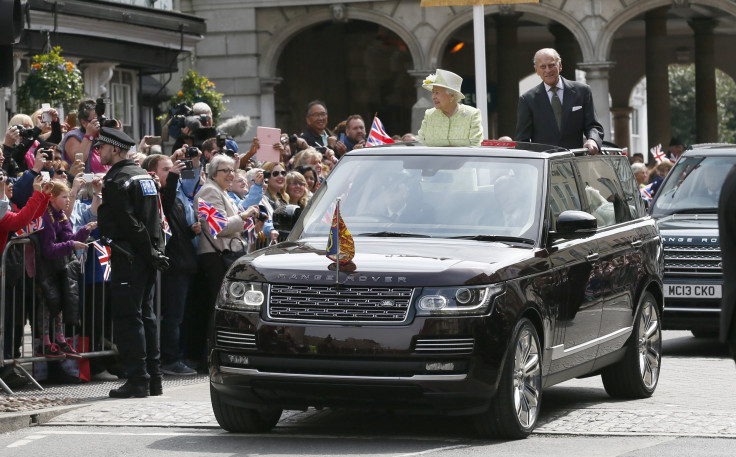 Britain's Queen Elizabeth is driven past well wishers on her 90th birthday with Prince Philip 