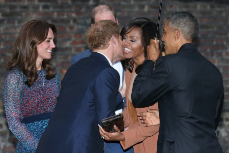 Britain's Prince Harry greets U.S. first lady Michelle Obama while President Barack Obama, Prince William and his wife Catherine, Duchess of Cambridge look on