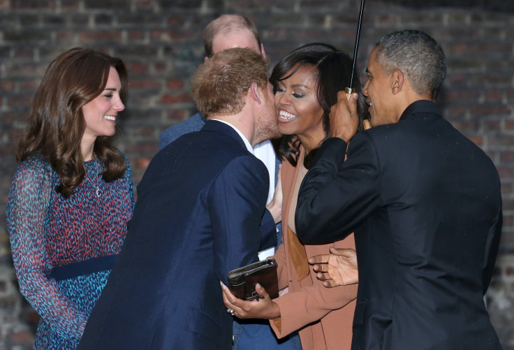Britain's Prince Harry greets U.S. first lady Michelle Obama while President Barack Obama, Prince William and his wife Catherine, Duchess of Cambridge look on