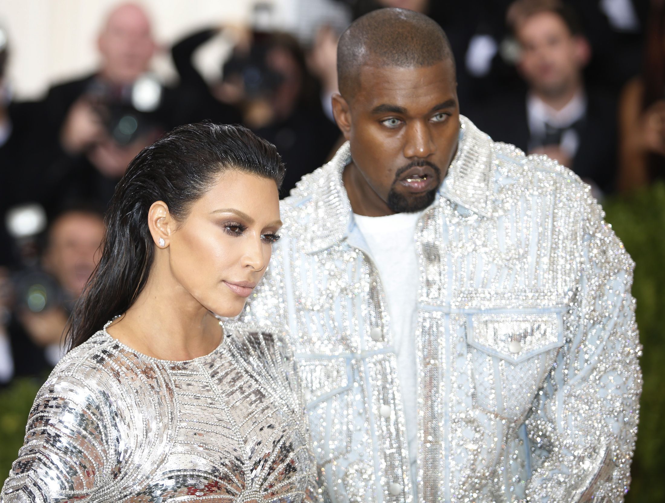 Kanye West R and wife Kim Kardashian