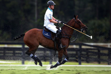 Prince Harry plays polo in the rain