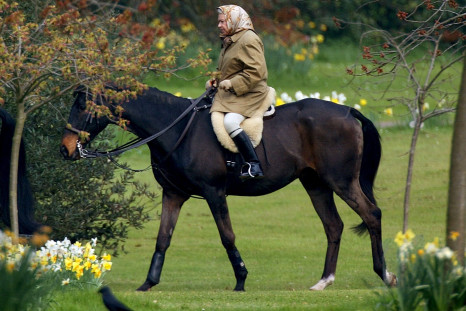 Queen Elizabeth rides her horse in the grounds of Windsor Castle