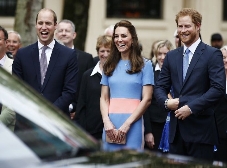 Prince William, the Duchess of Cambridge and Prince Harry (R) 
